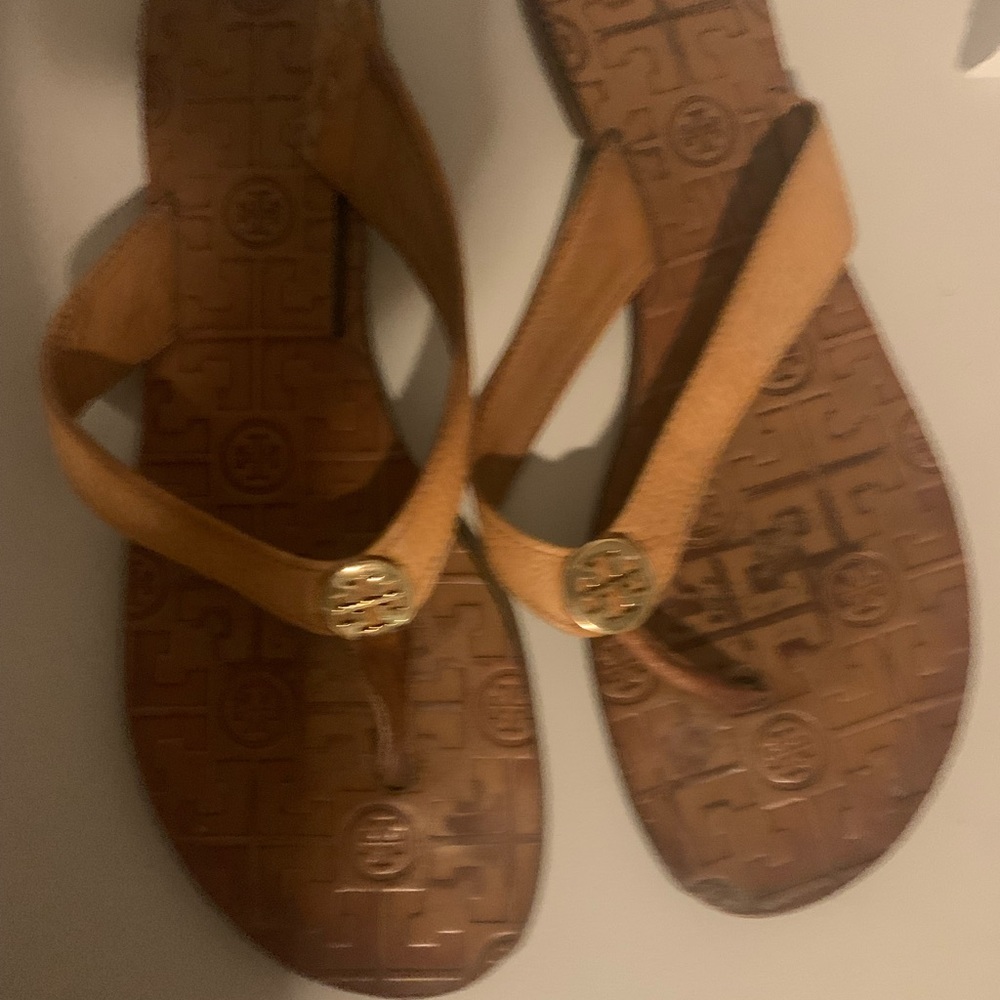 Tan leather flip flops